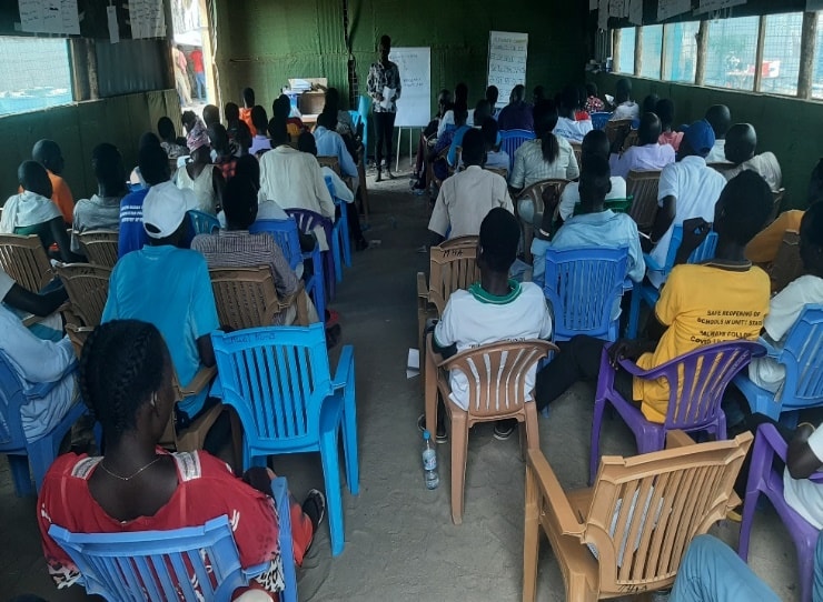 Facilitator leads a basic education session with youth corps members.